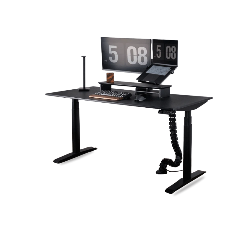 The Omnidesk Essential Black Height-Adjustable Desk presents a modern, functional workspace with its spacious matte black tabletop and robust, adjustable legs. It effectively accommodates a dual-monitor setup, a laptop on a riser, and other peripherals, suggesting an ergonomic design. Key features include a visible control panel for height adjustment, a sleek desk lamp, and an integrated cable management spine that maintains a clean, organized aesthetic. Overall, it appears as a sturdy and adaptable solution for a productive work environment.