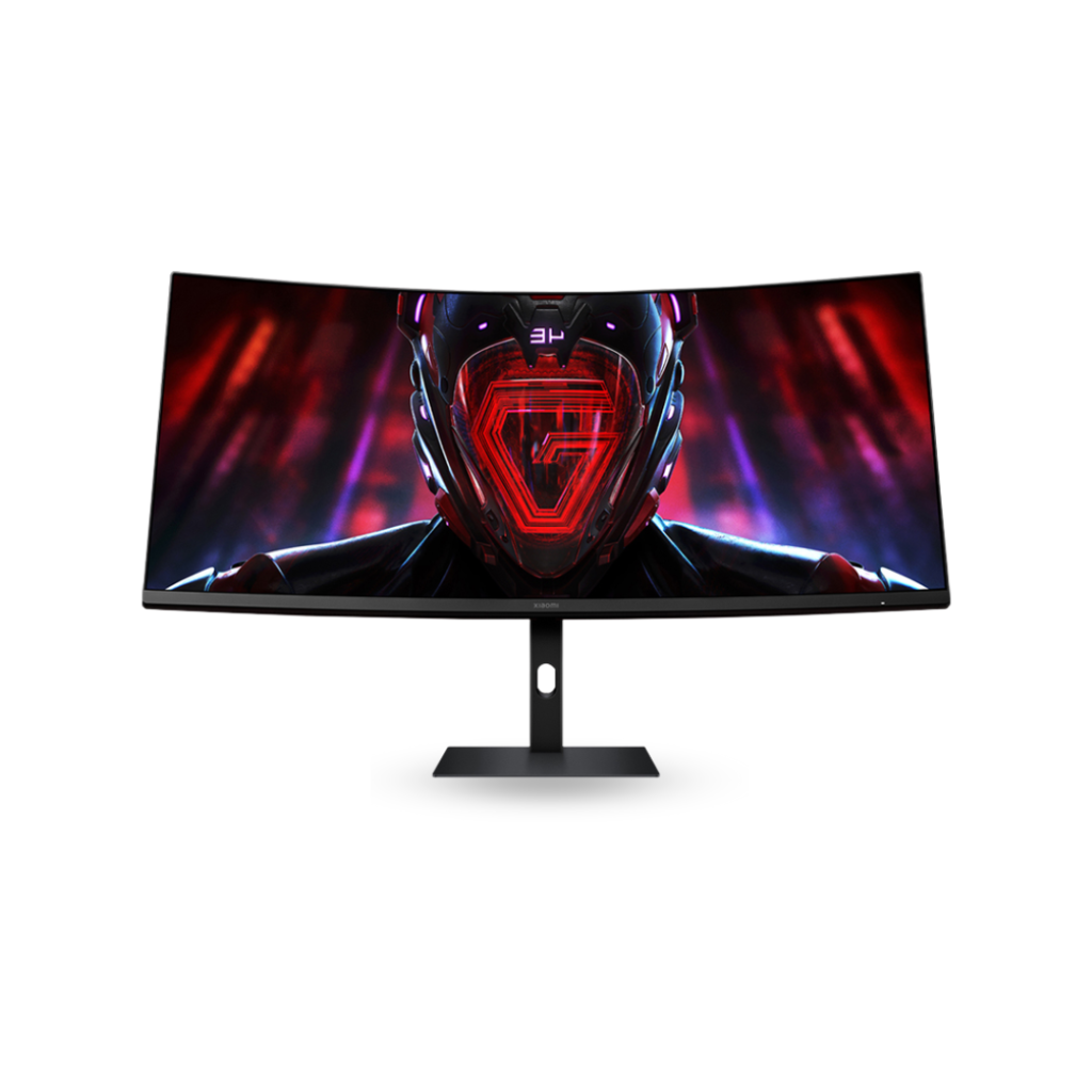 A front-facing view of the Xiaomi Mi Curved Display G34WQi 34-inch gaming monitor. The black, ultrawide curved screen is prominently featured on a minimalist stand, displaying an intense, futuristic graphic of a red and black helmet with glowing lines, indicative of its high-resolution gaming capabilities.