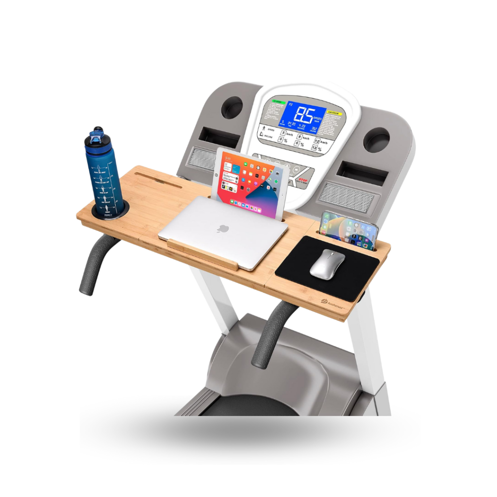 A "JOSHMAR Treadmill Laptop Desk" attached to the handlebars of a treadmill. The desk is a wooden plank with carved-out sections to hold various items. On the left, there is a circular holder for a blue water bottle. In the middle, a laptop and a tablet are placed in a recessed slot. On the right, a slot holds a smartphone upright, and a black mousepad with a wireless mouse is located next to it. The treadmill's control panel, with a digital display and buttons, is visible behind the desk.